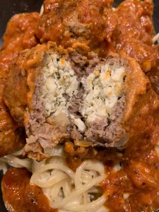 Lamb and Beef Meatballs Stuffed with Feta Cheese over Spaghetti with Vodka Sauce | Dishin' With Darla